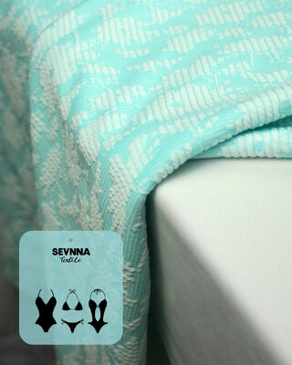 قماش سباحة فاخر محكم الملمس بعرض 135 سم ووزن 195 جرامًا لكل متر مربع وتركيبة 50% بوليستر معاد تدويره